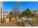 Back deck with a table and chairs offering an outdoor dining space at 7661 Chickaree Ct, Littleton, CO 80125