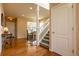 Entryway with hardwood floors, staircase, and white trim creates a welcoming space at 7661 Chickaree Ct, Littleton, CO 80125