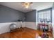 An exercise room with hardwood floors and a large window at 7661 Chickaree Ct, Littleton, CO 80125