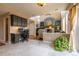 Living space with hardwood floors, fireplace, and lots of natural light with built-in desk at 7661 Chickaree Ct, Littleton, CO 80125