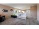 Loft area featuring neutral carpet, white railing and lots of light at 7661 Chickaree Ct, Littleton, CO 80125