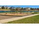 Community playground with lake backdrop, offering a fun recreational area at 7661 Chickaree Ct, Littleton, CO 80125