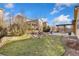 Well maintained back yard with a rock lined garden and a cozy, shaded outdoor living area at 15980 Pikes Peak Dr, Broomfield, CO 80023