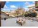 Landscaped backyard with fire pit and pergola at 15980 Pikes Peak Dr, Broomfield, CO 80023