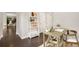 Cozy home office space featuring a modern desk, stylish shelving, and dark wood floors for a productive workspace at 15980 Pikes Peak Dr, Broomfield, CO 80023