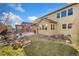 Exterior view of two story home with large backyard at 15980 Pikes Peak Dr, Broomfield, CO 80023