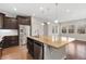 Modern kitchen with large island and stainless steel appliances at 15980 Pikes Peak Dr, Broomfield, CO 80023