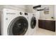 Laundry room with LG washer and dryer, and a sink at 15980 Pikes Peak Dr, Broomfield, CO 80023