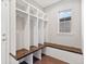 Mudroom with built-in storage lockers, a bench, and a window for natural light at 15980 Pikes Peak Dr, Broomfield, CO 80023