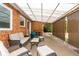 This back patio features a brick structure with outdoor seating and a retractable awning at 1386 S Garfield St, Denver, CO 80210