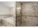 This bathroom features a tiled shower with glass door and a soaking tub at 1386 S Garfield St, Denver, CO 80210