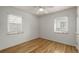 This bright bedroom offers hardwood floors, natural light from its two windows, and white walls at 1386 S Garfield St, Denver, CO 80210