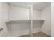 Empty walk-in closet with neutral carpet and white walls and shelving at 1386 S Garfield St, Denver, CO 80210