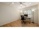 A cozy office features hardwood floors, neutral walls, a ceiling fan, and bright natural light at 1386 S Garfield St, Denver, CO 80210