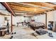 Unfinished basement with exposed ceiling, offering a spacious area and potential for customization at 2116 W 101St Cir, Thornton, CO 80260