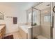 Bright bathroom with a separate tub and shower with tiled surround and a large window at 2116 W 101St Cir, Thornton, CO 80260