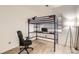 Bedroom featuring lofted bed above desk with modern laminate flooring and a large window at 2116 W 101St Cir, Thornton, CO 80260