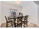Dining area featuring a wooden table with seating, and natural light at 2116 W 101St Cir, Thornton, CO 80260