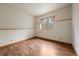 Minimalist bedroom featuring hardwood flooring and a window for natural light; ready for your personal touch at 23007 Big Game Trl, Conifer, CO 80433