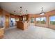 Open concept kitchen with wood cabinets, granite countertops, stainless steel appliances, and natural light at 23007 Big Game Trl, Conifer, CO 80433