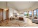 Bright main bedroom offers a luxurious retreat with scenic views from the large windows and comfortable seating at 23007 Big Game Trl, Conifer, CO 80433