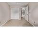 This carpeted bedroom includes a closet and an open doorway at 6358 E 121St Pl, Brighton, CO 80602