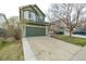 Attractive home with stone accents, a covered porch, and an attached two-car garage at 6358 E 121St Pl, Brighton, CO 80602