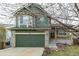 Charming two-story home featuring a stone-accented garage and welcoming front porch at 6358 E 121St Pl, Brighton, CO 80602