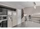 Modern kitchen featuring dark cabinets and stainless steel refrigerator at 6358 E 121St Pl, Brighton, CO 80602