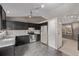 Kitchen with dark cabinets and stainless steel appliances at 6358 E 121St Pl, Brighton, CO 80602