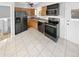 Kitchen with stainless steel appliances and light wood cabinets at 481 S Lima Cir, Aurora, CO 80012