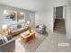 Virtually staged living room with gray sofas and a coffee table at 481 S Lima Cir, Aurora, CO 80012