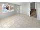 Living room with tile floors and staircase at 481 S Lima Cir, Aurora, CO 80012