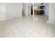 Bright living room with tile flooring and view into kitchen at 481 S Lima Cir, Aurora, CO 80012