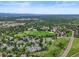 Aerial view of a community featuring homes, parks, and recreational areas at 2974 E Otero Cir, Centennial, CO 80122