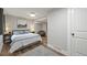 Bedroom featuring a comfortable queen-sized bed, gray rug, and stylish decor at 2974 E Otero Cir, Centennial, CO 80122