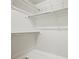 A walk-in closet provides ample storage with its multiple rods for hanging clothes at 2974 E Otero Cir, Centennial, CO 80122