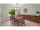 Elegant dining room with wood table, chandelier, and built-in cabinetry, perfect for entertaining at 2974 E Otero Cir, Centennial, CO 80122