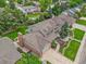 An aerial view shows a beautifully landscaped two-story home with a well-manicured lawn at 2974 E Otero Cir, Centennial, CO 80122
