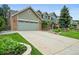 Charming two-story home with a large driveway, brick accents, and mature landscaping at 2974 E Otero Cir, Centennial, CO 80122