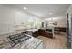 Open kitchen boasts wood flooring, stainless steel appliances, granite counters and an eat-in dining area at 2974 E Otero Cir, Centennial, CO 80122