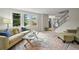 Cozy living room with large windows, plush seating, and a decorative rug at 2974 E Otero Cir, Centennial, CO 80122