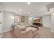 A spacious living area is furnished with a sectional sofa and features recessed lighting at 2974 E Otero Cir, Centennial, CO 80122
