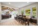 Open-concept living area features wood floors, large windows, and great natural light at 2974 E Otero Cir, Centennial, CO 80122