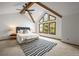 Bright main bedroom featuring vaulted ceilings, exposed beams, and large windows with natural light at 2974 E Otero Cir, Centennial, CO 80122