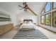 Spacious main bedroom with vaulted ceiling, exposed beam, stylish rug and large windows at 2974 E Otero Cir, Centennial, CO 80122