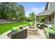 Stone patio with fire pit and comfortable seating, perfect for outdoor relaxation at 2974 E Otero Cir, Centennial, CO 80122