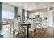 Dining area with hardwood floors, stylish furnishings, and sliding glass doors leading to the backyard at 3218 Belleville Ridge Rd, Elizabeth, CO 80107