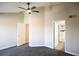 Comfortable bedroom features ceiling fan, closet and ensuite bathroom at 1652 Egret Way, Superior, CO 80027