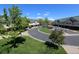 An aerial view of a well-maintained community with green spaces, trees and winding roads at 1652 Egret Way, Superior, CO 80027
